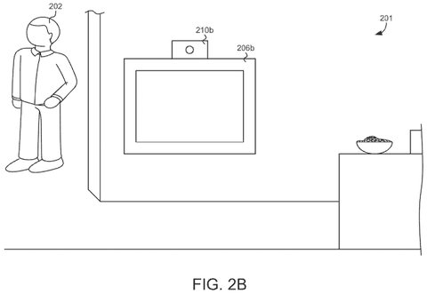 Person standing near TV with camera, drawing sheet 3 from US 2026/0292298 A1